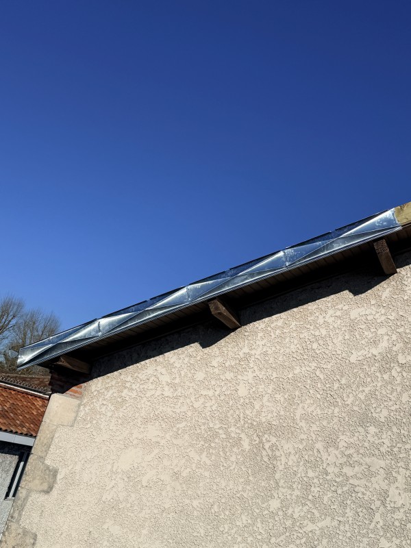 rive de bandeaux en zinc pointe de diamant 